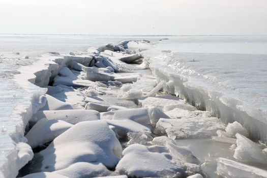 frozen Winter sea, the crack in the ice, background
