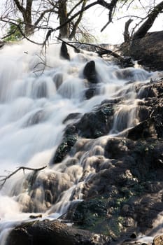 waterfall in the forest against the sky
