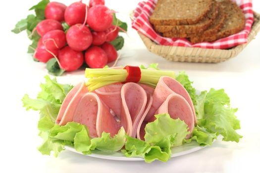 plate of fresh cold Beer Sausage and vegetables