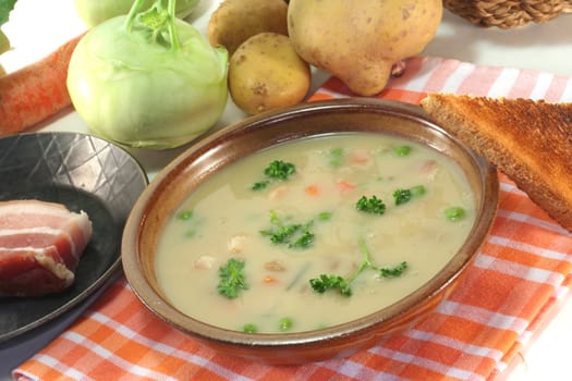 Potato soup with fresh parsley and bacon