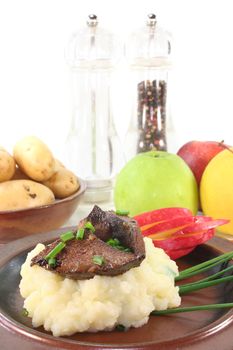 fried liver with mashed potatoes, apple and chives