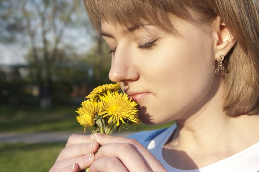 happy girl and dandelions