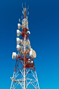 Communications tower with a beautiful blue sky