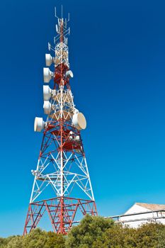 Communications tower with a beautiful blue sky