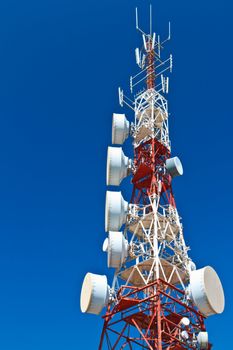 Communications tower with a beautiful blue sky