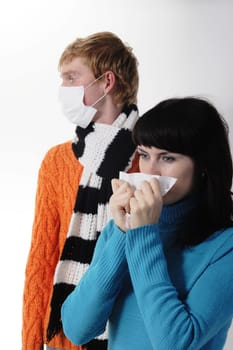 girl was ill of influenza, a man stands behind a mask A(H1N1)