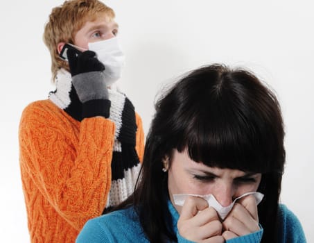 girl was ill of influenza, a man stands behind a mask A(H1N1)