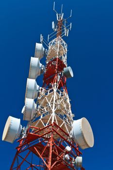 Communications tower with a beautiful blue sky