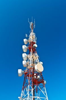Communications tower with a beautiful blue sky