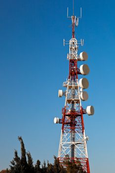 Communications tower with a beautiful blue sky