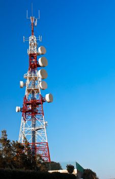 Communications tower with a beautiful blue sky