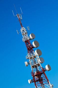Communications tower with a beautiful blue sky