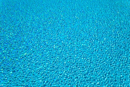 Abstract composition of the water of a swimming pool and its reflections