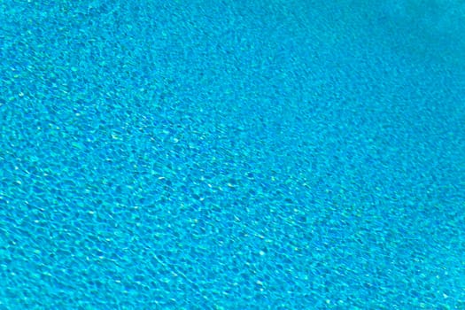 Abstract composition of the water of a swimming pool and its reflections