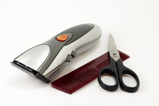 scissors comb  and  clipper  on a white background
