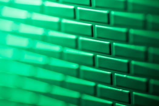 A wall formed by metal bricks
