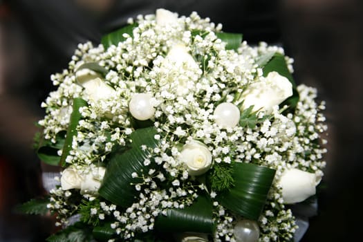 White wedding bouquet on a dark background
