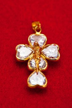 Pendant of a crucifix with five zirconia enchased