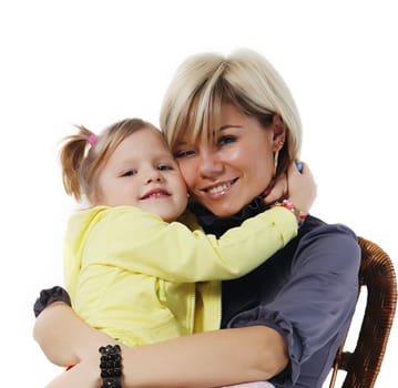 little girl hugs the young mother on the white background
