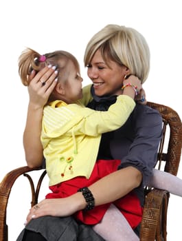 little girl hugs the young mother on the white background
