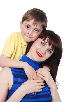 little boy hugs a young beautiful girl on the white background
