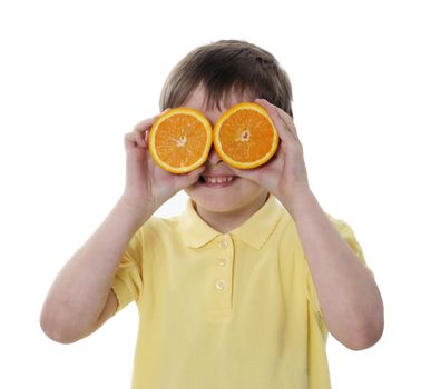 Conceptual image of a person holding oranges in front of eyes to ilustrate concept of humor