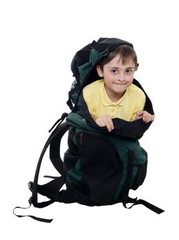 small boy in a big tourist backpack on the white background. (isolated)
