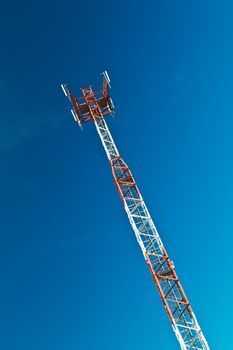 Communications tower with a beautiful blue sky