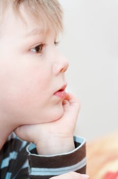 boy popping up his chin