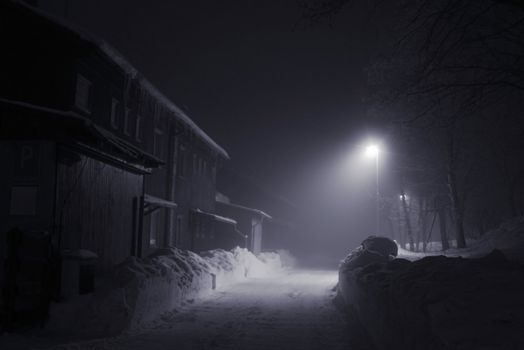 foggy night with street lamp