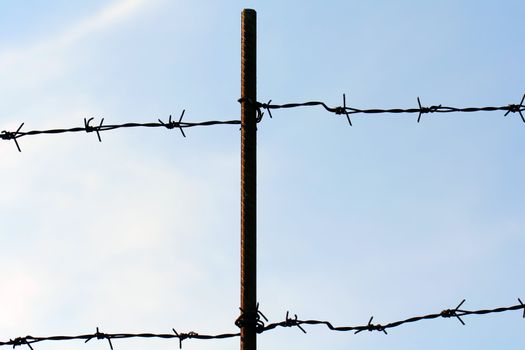 barbed wire on pole