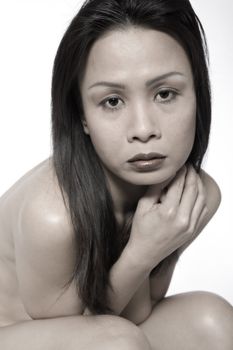 Studio portrait of a asian girl looking sad