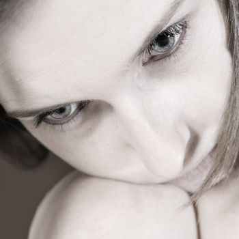 Studio portrait of a young woman in thoughts