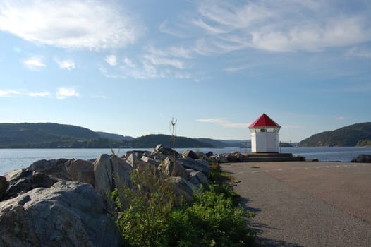 Smal light house at harbor entrance. Droebak Norvay.