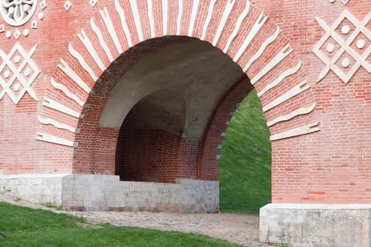 Fragment of red brick bridge with white ornament in Tsaritsino park. Moscow, Russia.