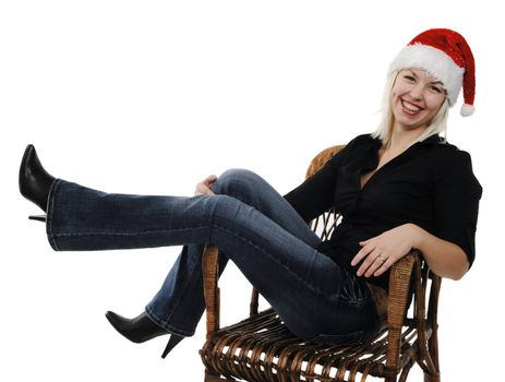 Young girl in a Santa Claus hat on the white background
