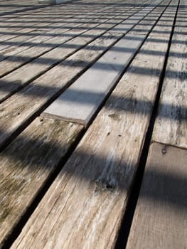Perspective of outdoor-wood -floor in daytime.