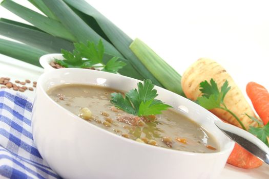 Lentil soup with potatoes, bacon and fresh parsley