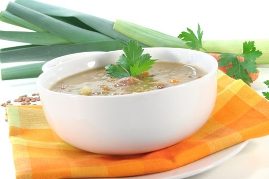 Lentil soup with potatoes, bacon and fresh parsley