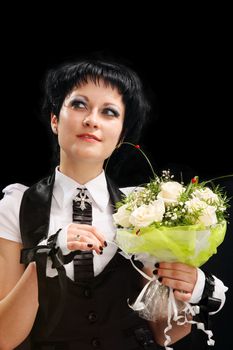 bride in a black hat with a black background
