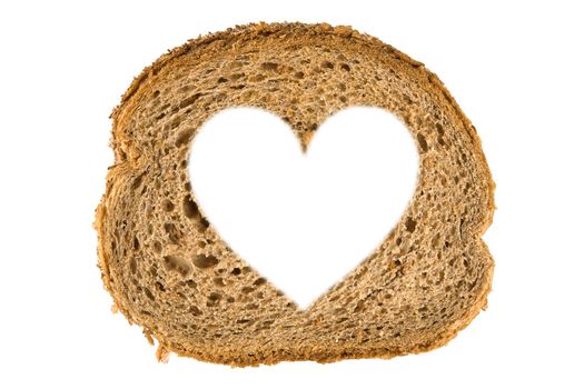 Heart shaped hole in a slice of bread, isolated on white