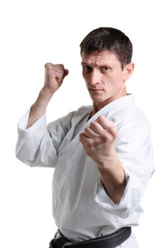 Karate. Man in a kimono with a white background