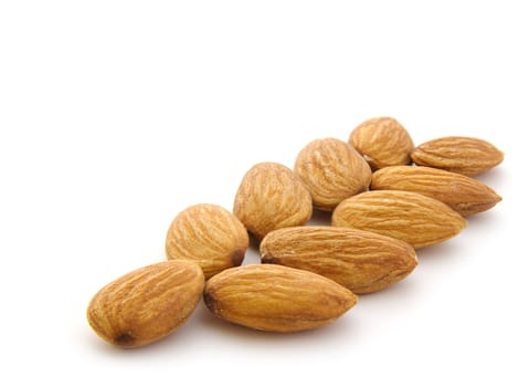 almonds in row isolanted on white background