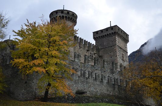 Medieval castle in a gloomy and cloudy day in fall