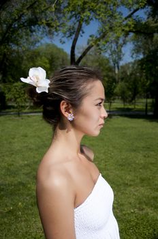 Portrait of the young woman in park