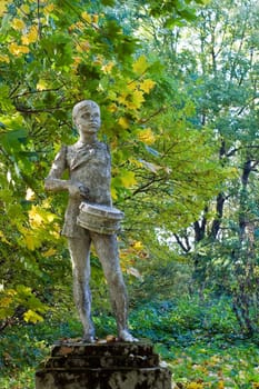 Old statue of a Soviet Pioneer in a park