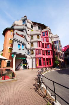 Building at the Schtroumpfs district, Geneva, Switzerland. Colored and unusual buildings of this quarter were built between 1982 and 1984 by three unconventional architects (Robert Frei, Christian Hunzicker and
Georges Berthoud) who were inspired by architect Gaudi.
