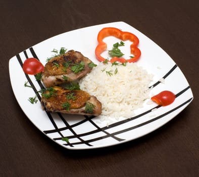 Chicken with rice on a plate