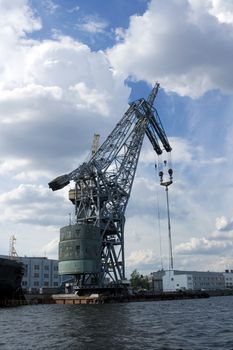 Crane at cargo pier in a port