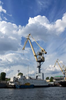 Crane at cargo pier in a port